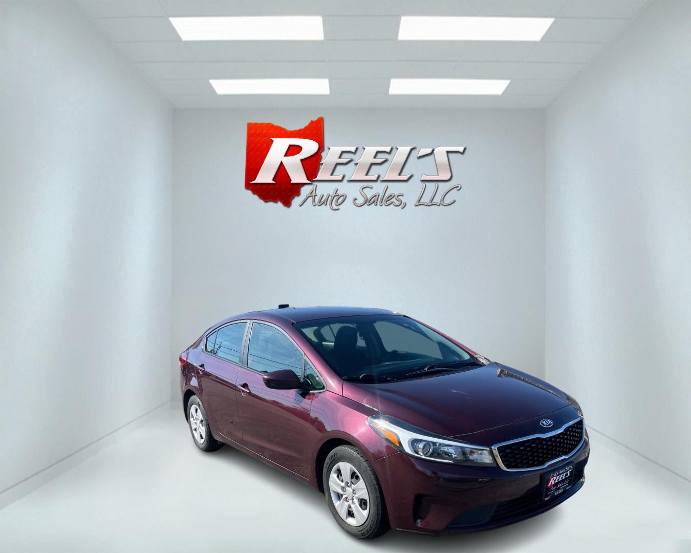 2017 Red /Black Kia Forte LX 6A (3KPFK4A76HE) with an 2.0L I4 DOHC 16V engine, 6A transmission, located at 547 E. Main St., Orwell, OH, 44076, (440) 437-5893, 41.535435, -80.847855 - This 2017 Kia Forte LX is a well-equipped compact sedan with a 2.0-liter four-cylinder engine paired with a smooth-shifting six-speed automatic transmission. It offers convenient features like daytime running lights, USB audio input, and Bluetooth connectivity for seamless audio streaming. Additiona - Photo#2